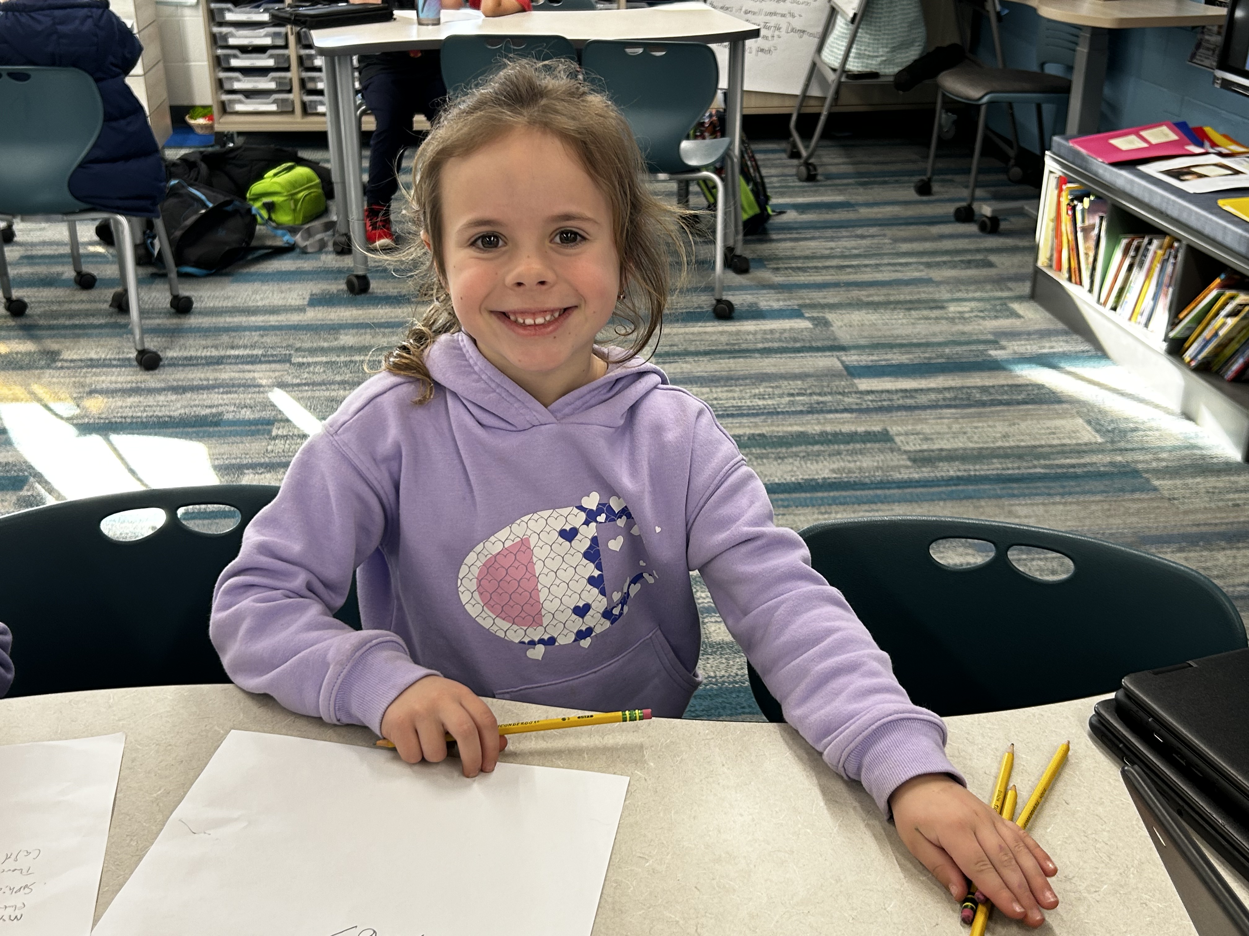 Smiling student creating with AI
